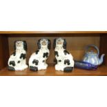 Three Staffordshire black and white spaniel ornaments, 26cm, a blue glass rolling pin, 38cm long and