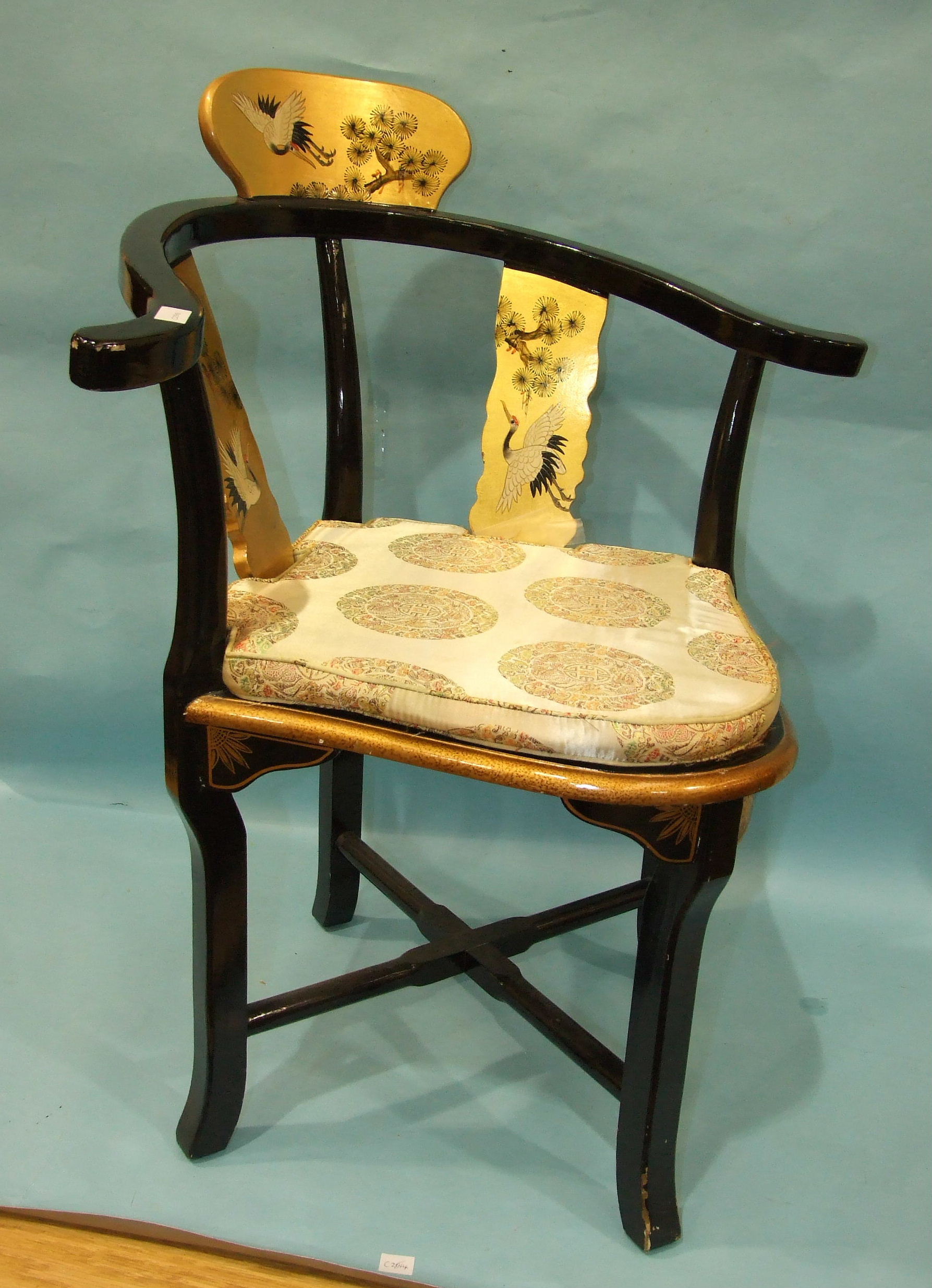 A lacquered and painted corner chair decorated with cranes.