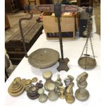 A set of W T Avery Class E balance scales, together with a collection of brass and iron weights,
