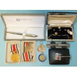 A single 9ct gold cufflink, 2.9g, two boxed Special Constabulary medals to William J White, Devon, a