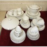 A collection of Royal Worcester bone china dinner, tea and coffee ware with white and silver