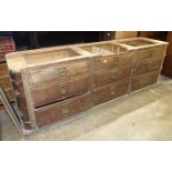 An early-20th century bank of nine hardwood drawers, each with recessed handles and vacant name