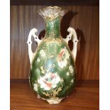 An Austrian ceramic baluster shape two-handled vase decorated with gilt, enamel and painted poppies,