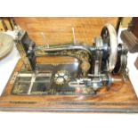 A decorative painted and gilded vintage sewing machine inlaid with mother-of-pearl, in walnut