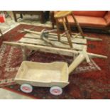 A pine pig truckle, 170 x 57cm, a washing dolly, a stool and a trolley, (4).