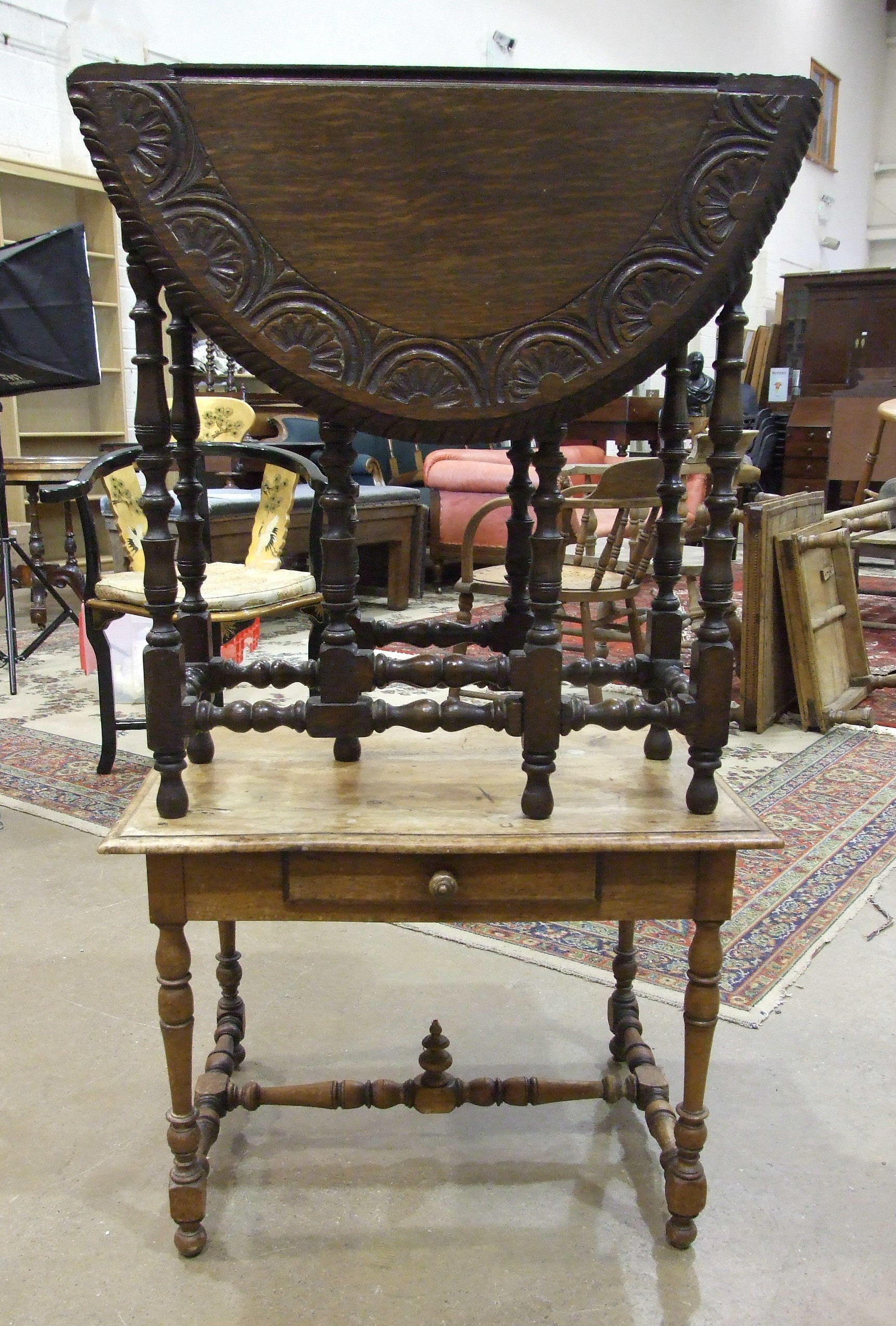 A faded mahogany rectangular-top low table fitted with a single drawer, on turned legs and