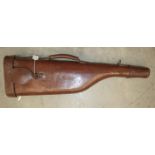 A leather 'leg o'mutton' gun case with initials F.W.C, 85cm long.