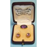 A pair of Victorian amethyst earrings, 1.7cm long, the hook fitting with cannetile mounts, cased