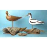 A modern carved wood and poker-work painted model of an avocet on driftwood base, 34cm high, (chip