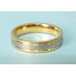 An 18ct yellow and white gold wedding ring, size T, 9.6g.