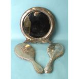 A Victorian silver-backed hand mirror, London 1890, stamped Clark, Old Bond Street, a later beaten-