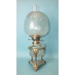 A silver-plated oil lamp, the cut-glass reservoir with plated burner by E J Shaw & Co, on ram's head