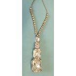 A 20th century necklace of four graduated rectangular cushion-cut white pastes with foiled backs