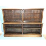 A large 19th century rosewood open sectional low bookcase, the shallow upper part with four
