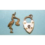 A 9ct gold charm in the form of a stork carrying a baby and a 9ct gold padlock clasp, 4.6g, (2).