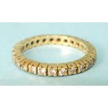 A diamond eternity ring claw-set twenty-seven brilliant-cut diamonds, in unmarked yellow gold mount