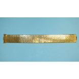 A 9ct gold flexible bracelet of textured panels, 17cm long, 2cm wide, 25.5g, cased.
