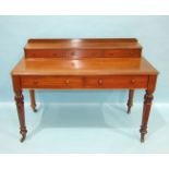 A Victorian mahogany dressing table, the rectangular top surmounted by three small drawers above two