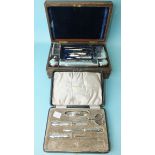 A silver-handled manicure set in fitted box, (scissors replaced by a steel pair), Birmingham 1919
