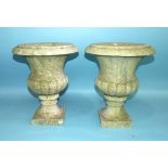 A pair of white marble campana-shaped urns on square bases, 36cm high, 29.5cm diameter, (2).