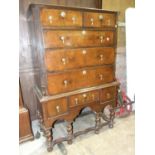 A mainly-18th-century walnut partially-banded chest of two short and three long drawers, within