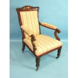A late-Victorian oak upholstered salon chair with carved frame, on short turned legs with castors.