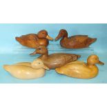 A carved wood duck with carved feather detail signed 'A-J 95', 30cm long, 14cm high, another, (