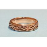 A 9ct rose gold wedding band with raised Celtic decoration, 5mm wide, size O½, 4.1g.