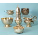 A modern octagonal sugar caster, four sugar bowls and a cream jug, various dates and makers,