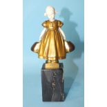 H Dietrich, a bronze and ivory figure of a Dutch girl holding a basket in each hand, on veined