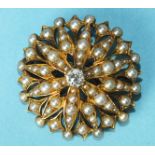 A late-Victorian diamond and seed pearl flower-head brooch/pendant centrally-set an old brilliant-