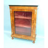 A Victorian inlaid walnut gilt-metal-mounted dwarf bookcase, having a single glazed door, on short