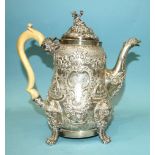 A Regency coffee pot of slightly-bellied form, the figural finialled lid and shaped ivory handle