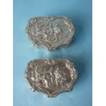 A pair of shaped silver boxes with embossed lids and serrated bases, London 1894, (2).