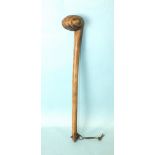 A Kenyan tribal war club with swirl-carved knob, 54cm long, (bleached).