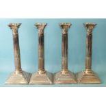 A set of four 20th century silver-plated candlesticks of Corinthian column form, with beaded stepped