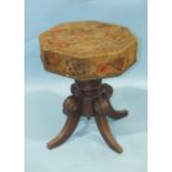 An early-19th century mahogany music stool, the revolving adjustable seat, with original