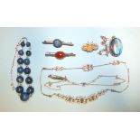 A necklace of graduated sodalite and paste beads, a blue and white paste necklace, a small silver