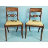 A set of eight George IV mahogany dining chairs, each with pierced and reeded curved back and drop-