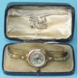 A lady's gold-cased wrist watch on 9ct gold expanding bracelet, gross weight 24.9g, cased, (not