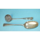 A George III sifter spoon with engraved decoration, the pierced bowl embossed with fruit, London