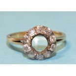 A diamond ring set a ring of ten old brilliant-cut diamonds, centre stone lacking, unmarked, tests