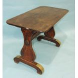 A 19th century mahogany centre table, the top on shaped end supports and curved trestle feet, with