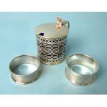A pierced cylinder mustard with blue glass liner, Chester 1908 and two 20th century napkin rings, (