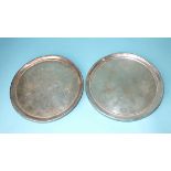 A pair of George III silver circular letter trays with coat of arms (worn) within beaded borders,