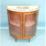 A 19th century half-round satinwood side cabinet, the marble top with central painted oval and