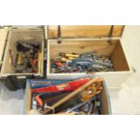 A large collection of woodworking and hand tools, including chisels, spanners, hammers, saws, etc,