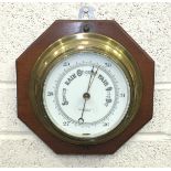 A 20th century brass bulkhead barometer by John Barker, 22cm diameter and a Sestrel brass ship's