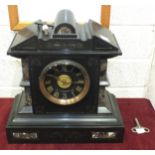 A late-19th century black slate and marble striking mantel clock of architectural form, the black