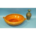 A Royal Lancastrian orange-glazed ceramic crocus bowl, 32cm diameter and a green and gilt-glazed